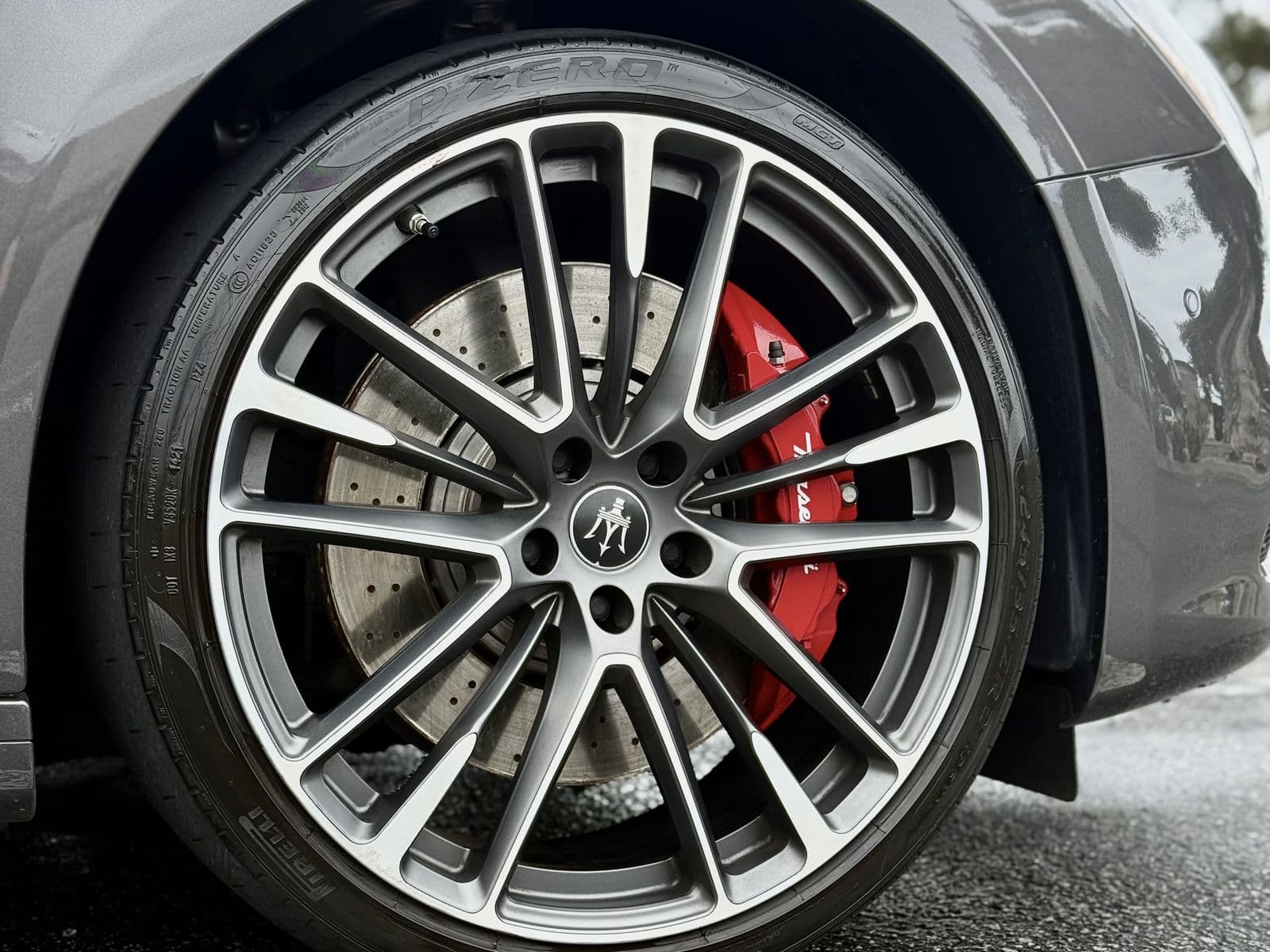 Maserati wheel and red brake caliper, cleaned and dressed to a polished finish